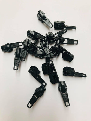 Black plastic-coated metal zip pullers or ‘sliders’ are to suit our continuous zip. 